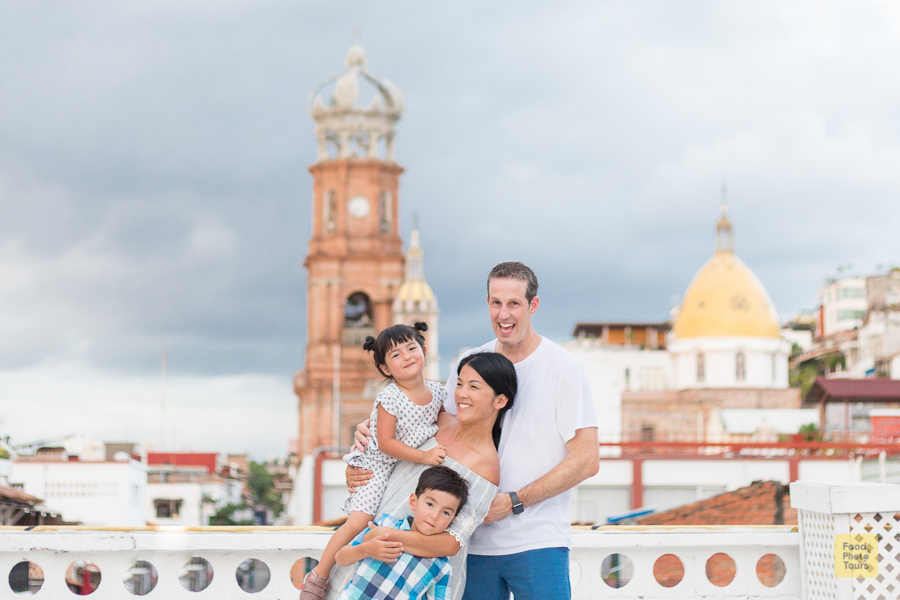Family Photo Shoot in Puerto Vallarta through streets of Downtown. A young mom and dad with two young children, a boy and a girl.