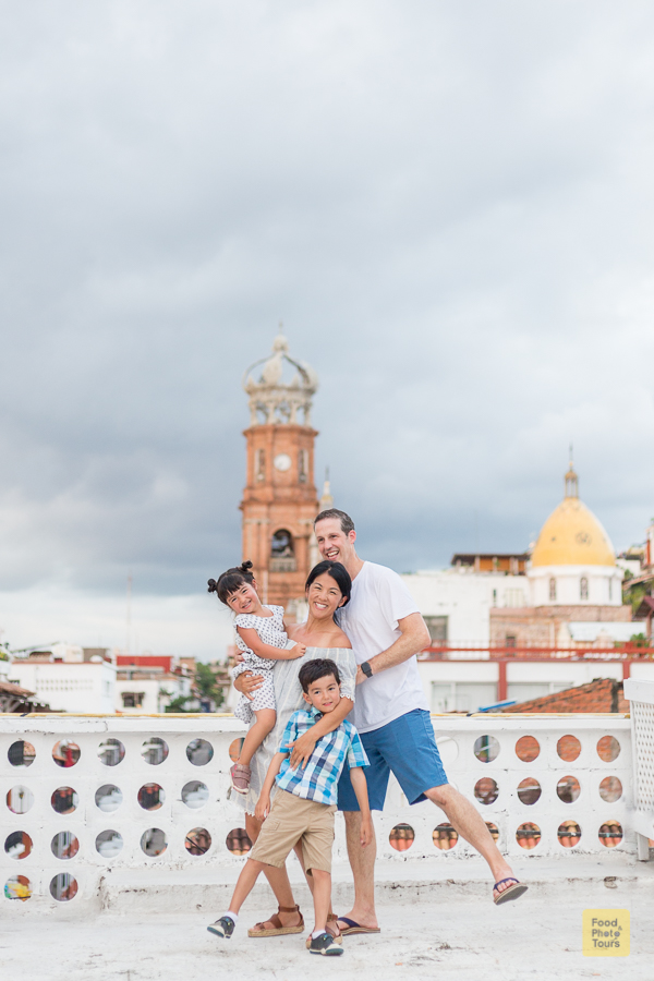 Family Photo Shoot in Puerto Vallarta through streets of Downtown. A young mom and dad with two young children, a boy and a girl.